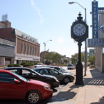 downtown Kansas City, Kan., with parked cars and old clock
