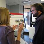 MARC staff member talks with open house attendee